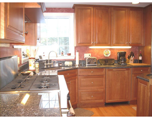 23 Deborah Road Hanover, MA 02339 - Photo 8 of 28 a kitchen with stainless steel appliances granite countertop a sink stove and cabinets