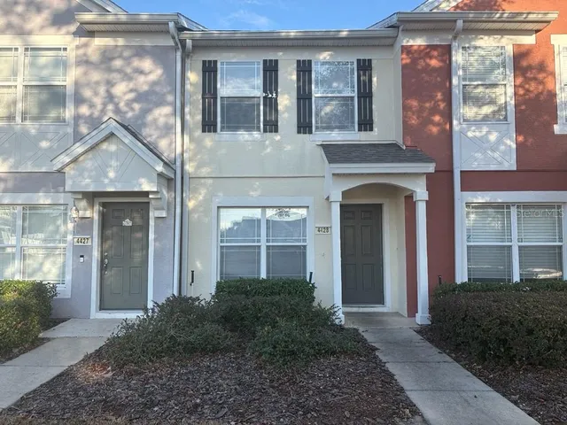 a view of a livingroom with a microwave and cabinets