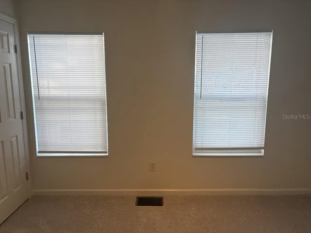an empty room with closet area