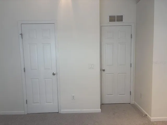 a white toilet sitting next to a bath tub