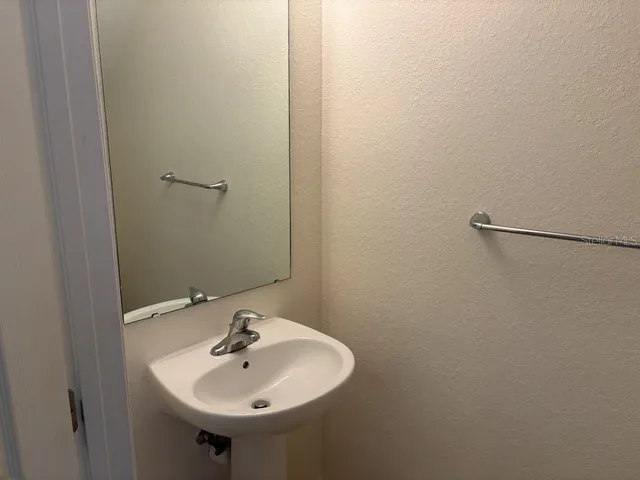 a bathroom with a toilet and a sink