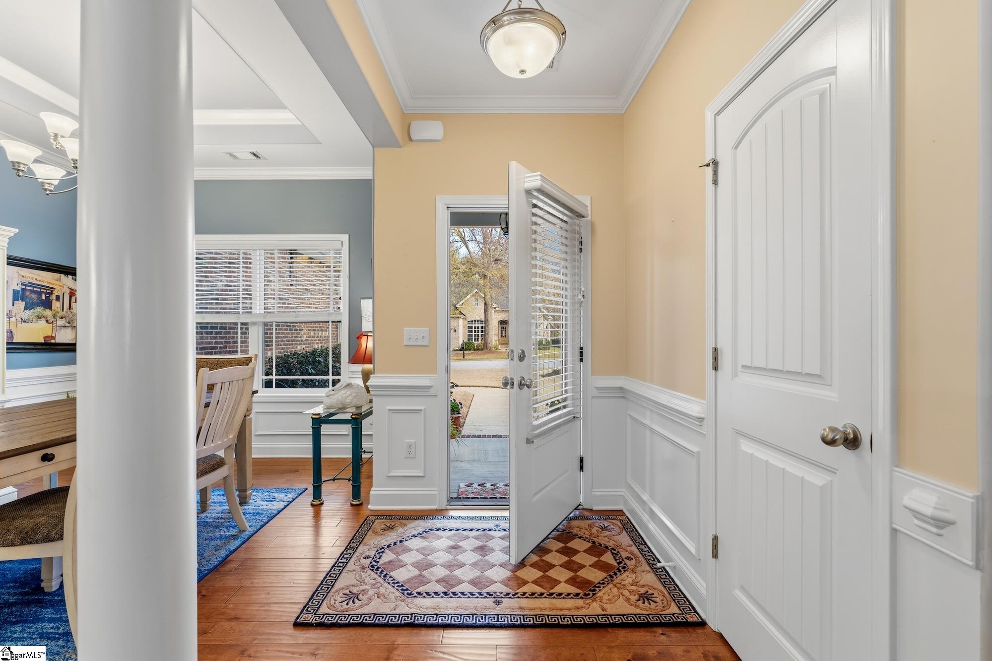 137 Prescott Drive Anderson, SC 29621 - Photo 4 of 31 Front door entry opens up to hardwood flooring, formal dining to right and large great room.