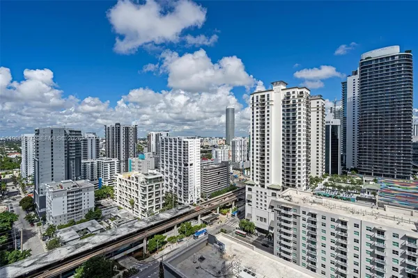 a view of a city with tall buildings