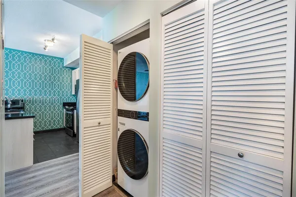a view of a hallway with washer and dryer