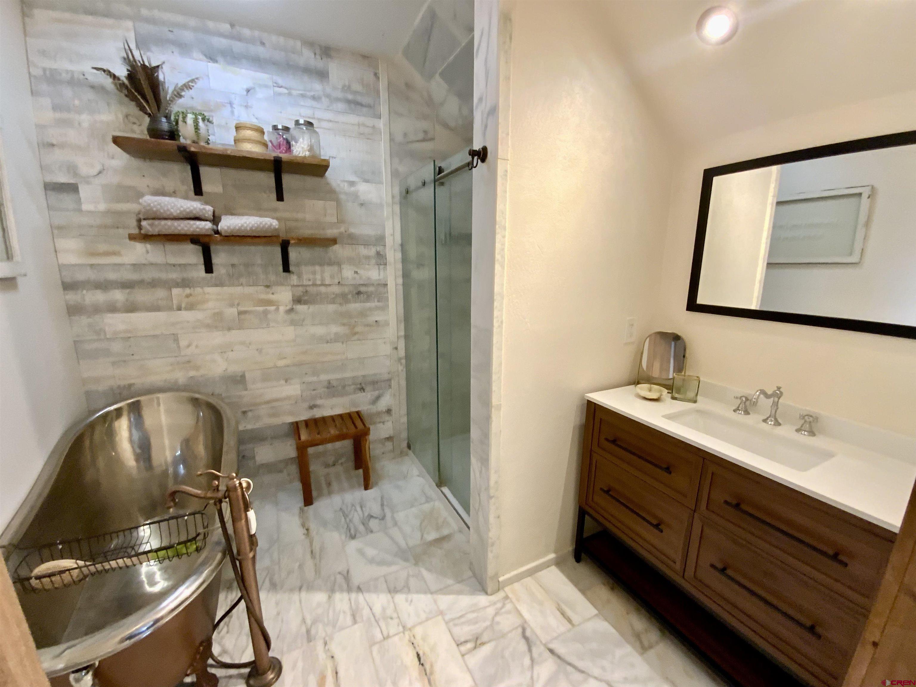 31876 State Highway Gunnison, CO 81230 - Photo 12 of 28 a bathroom with a sink and a mirror
