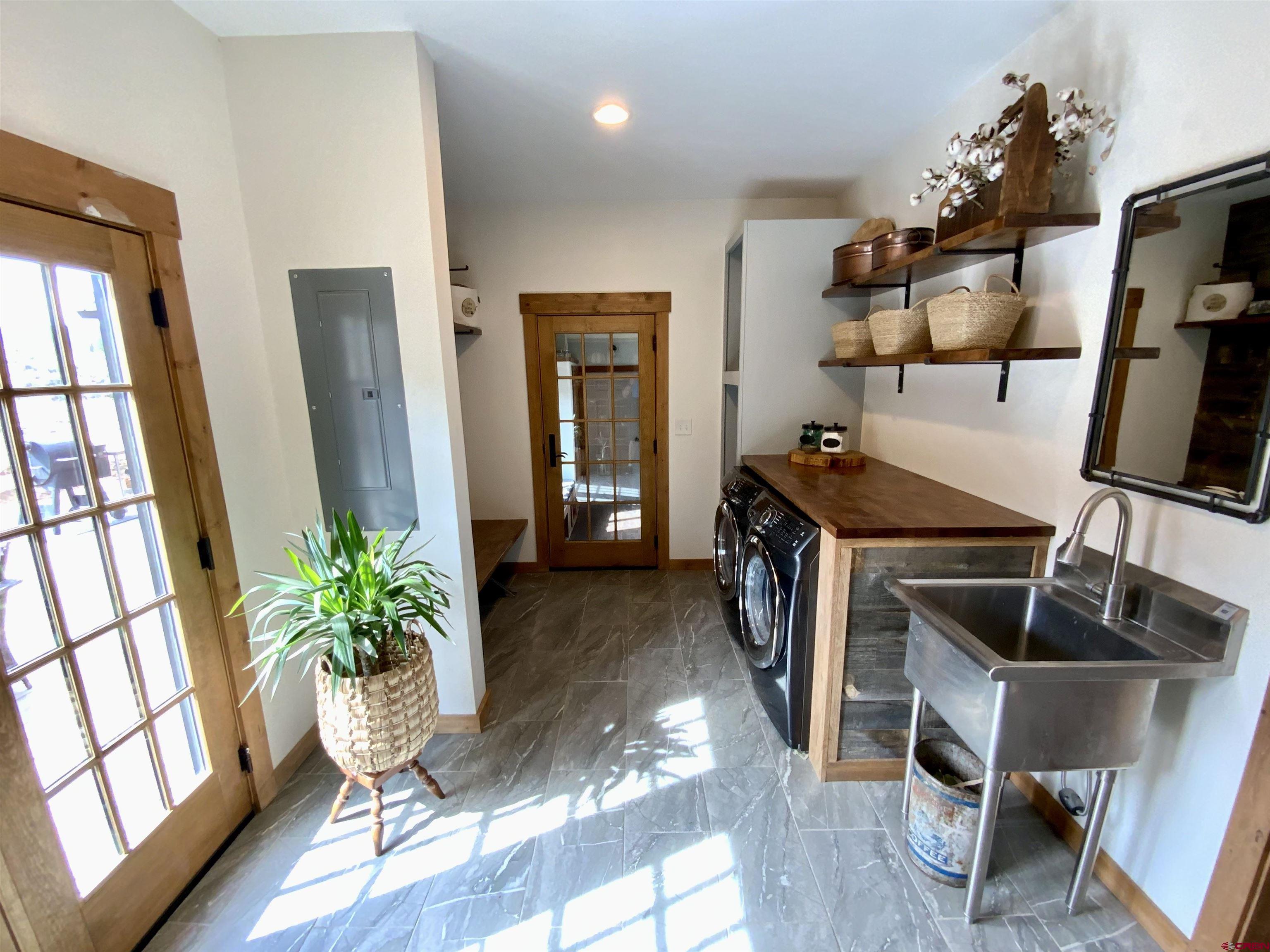 31876 State Highway Gunnison, CO 81230 - Photo 18 of 28 a living room with furniture and a flat screen tv