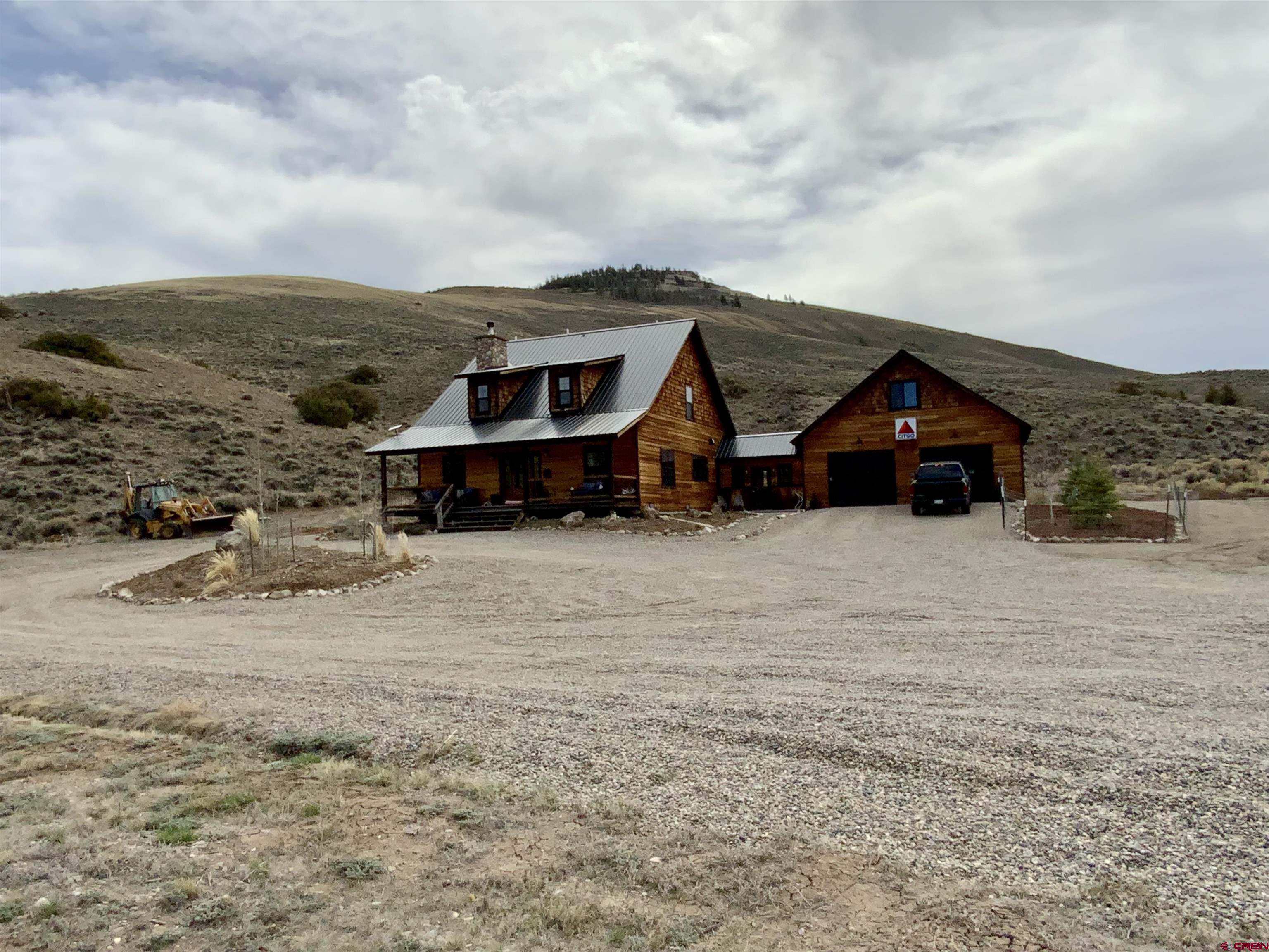 31876 State Highway Gunnison, CO 81230 - Photo 2 of 28 a view of house with a big yard