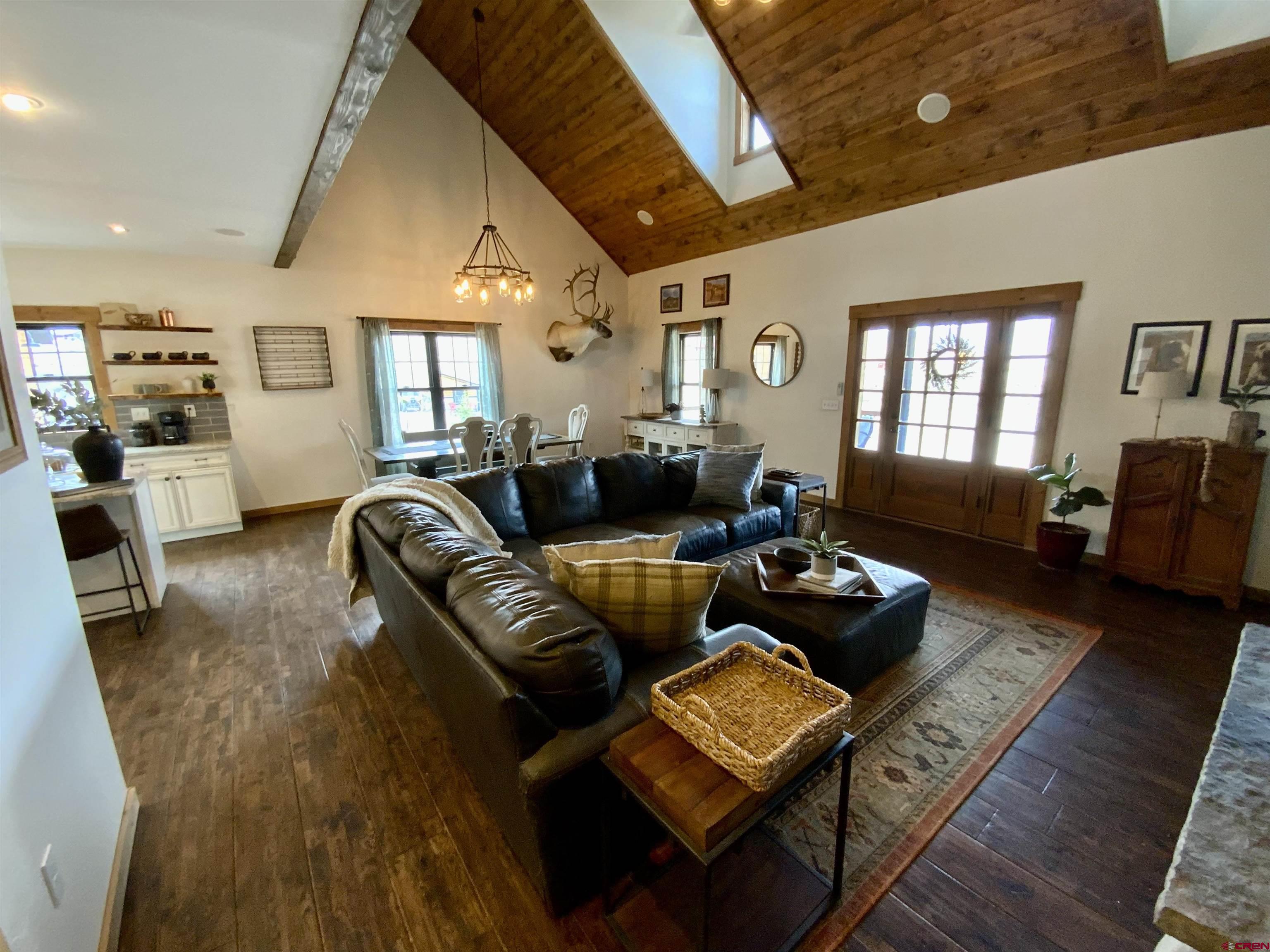 31876 State Highway Gunnison, CO 81230 - Photo 5 of 28 a living room with furniture and a fireplace