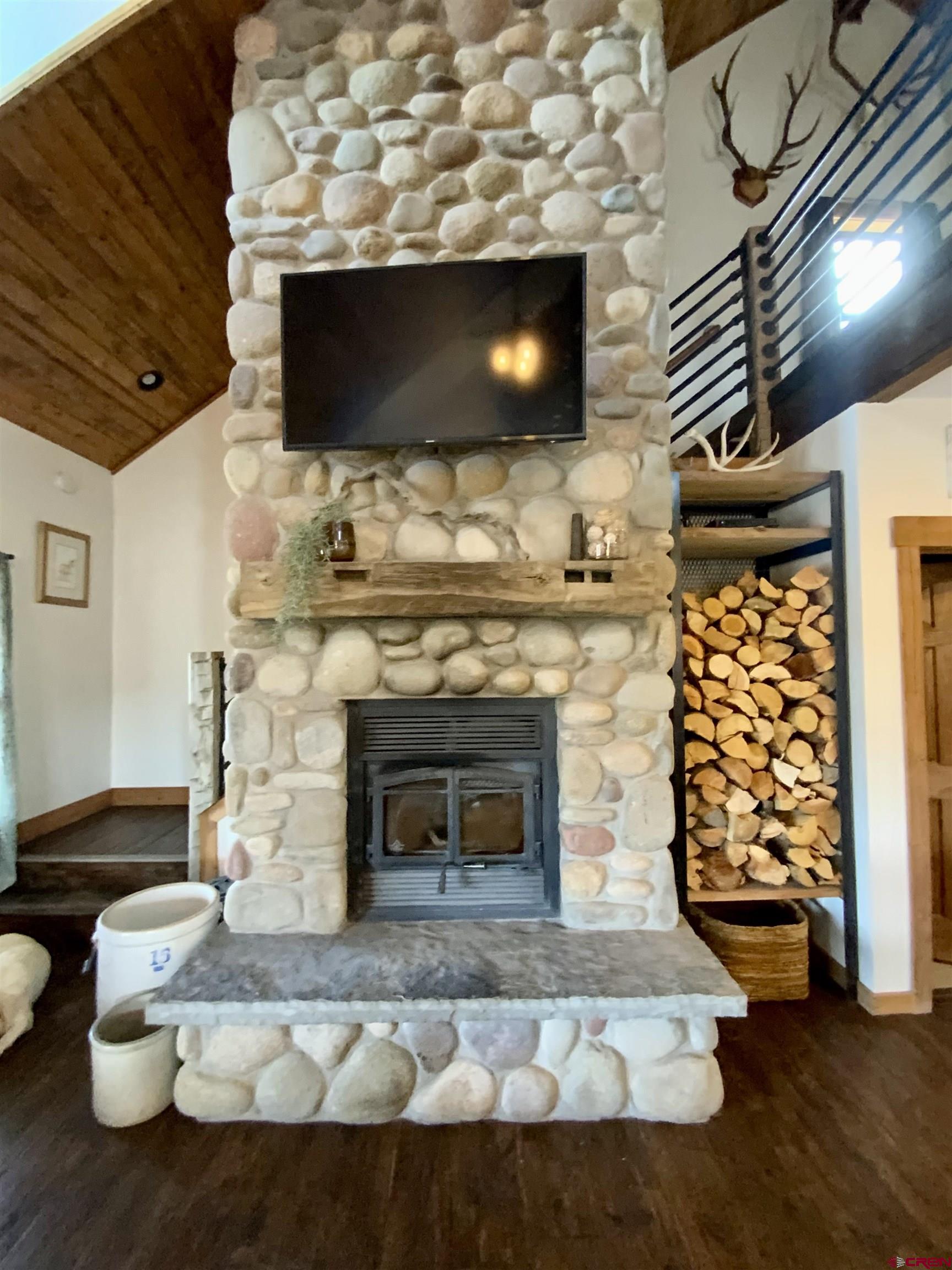 31876 State Highway Gunnison, CO 81230 - Photo 6 of 28 a living room with furniture and a fireplace
