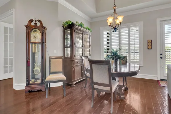 a view of a livingroom with furniture window and wooden floor