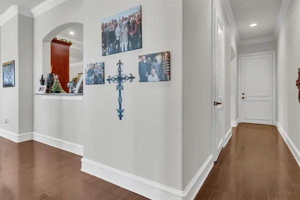 a view of a hallway with paintings on the wall
