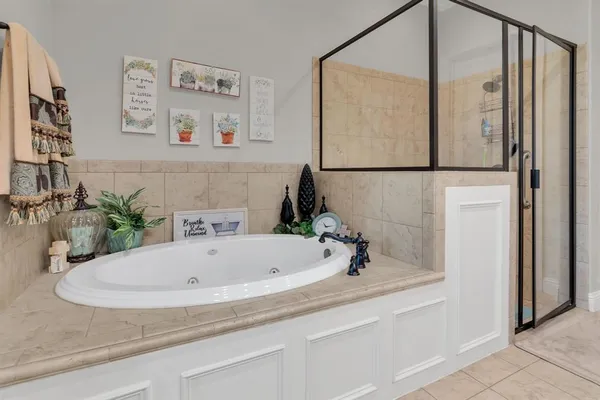a bathroom with a tub and a sink
