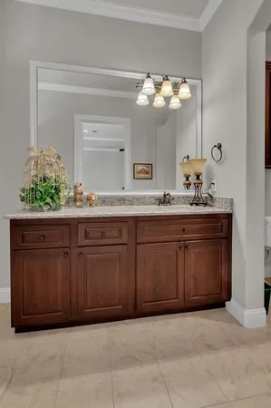 a kitchen with a sink and a mirror