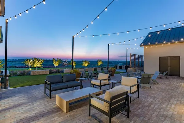 a outdoor living space with furniture and a fireplace
