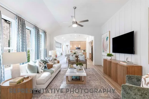 a living room with furniture and a flat screen tv