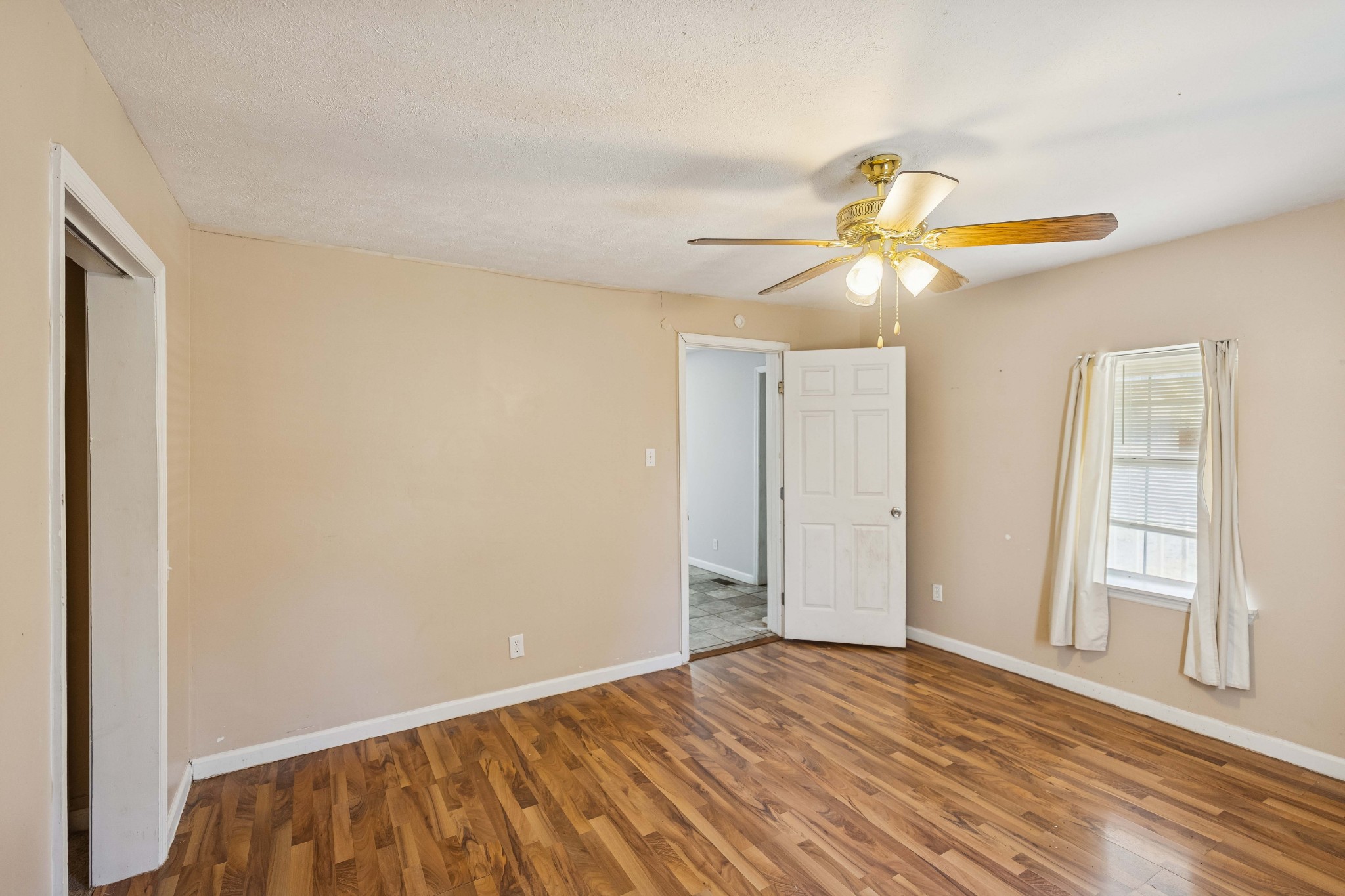 774 Enon Springs Road West Smyrna, TN 37167 - Photo 16 of 25 wooden floor in an empty room with a window
