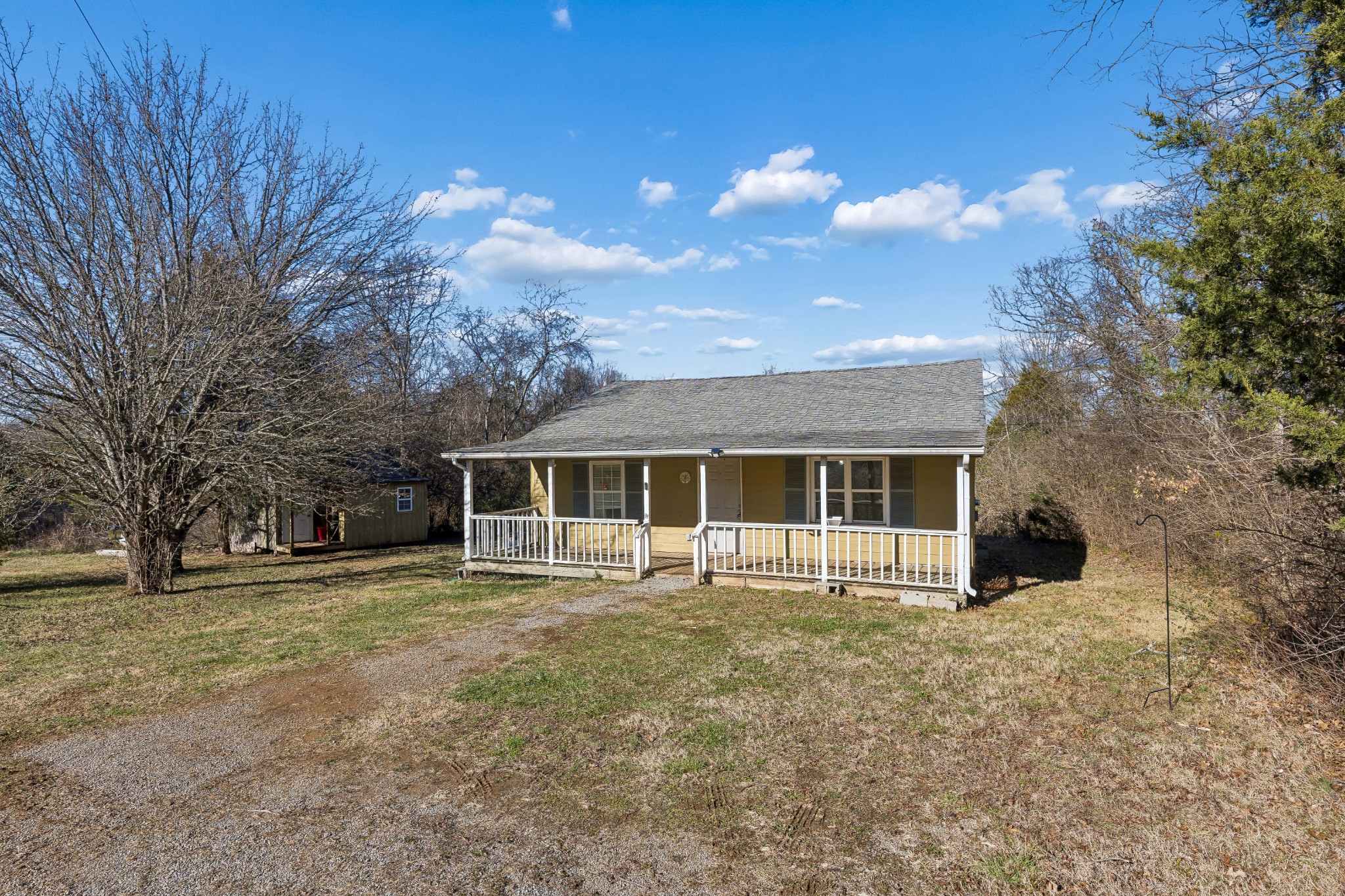 774 Enon Springs Road West Smyrna, TN 37167 - Photo 4 of 25 a front view of house with yard and trees in the background
