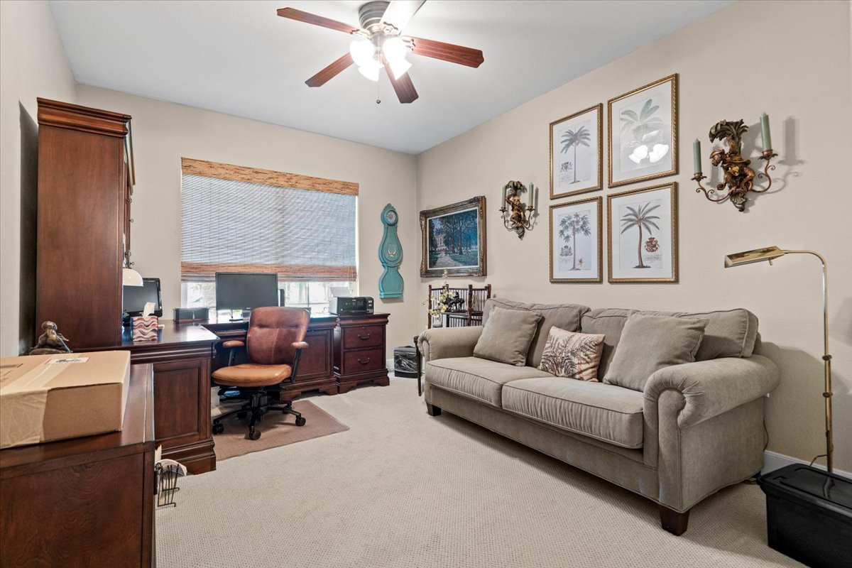 503 Breezeway Lane Georgetown, TX 78633 - Photo 26 of 38 Spacious second bedroom with flexibility for multiple uses, whether working from home, hobbies, or accommodating guests.