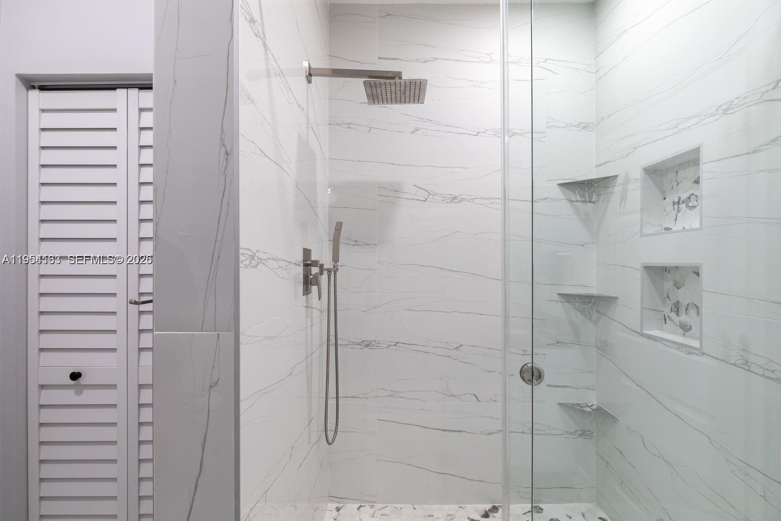 13216 Southwest 44th Street, Unit 11204 Miramar, FL 33027 - Photo 28 of 47 a bathroom with a shower