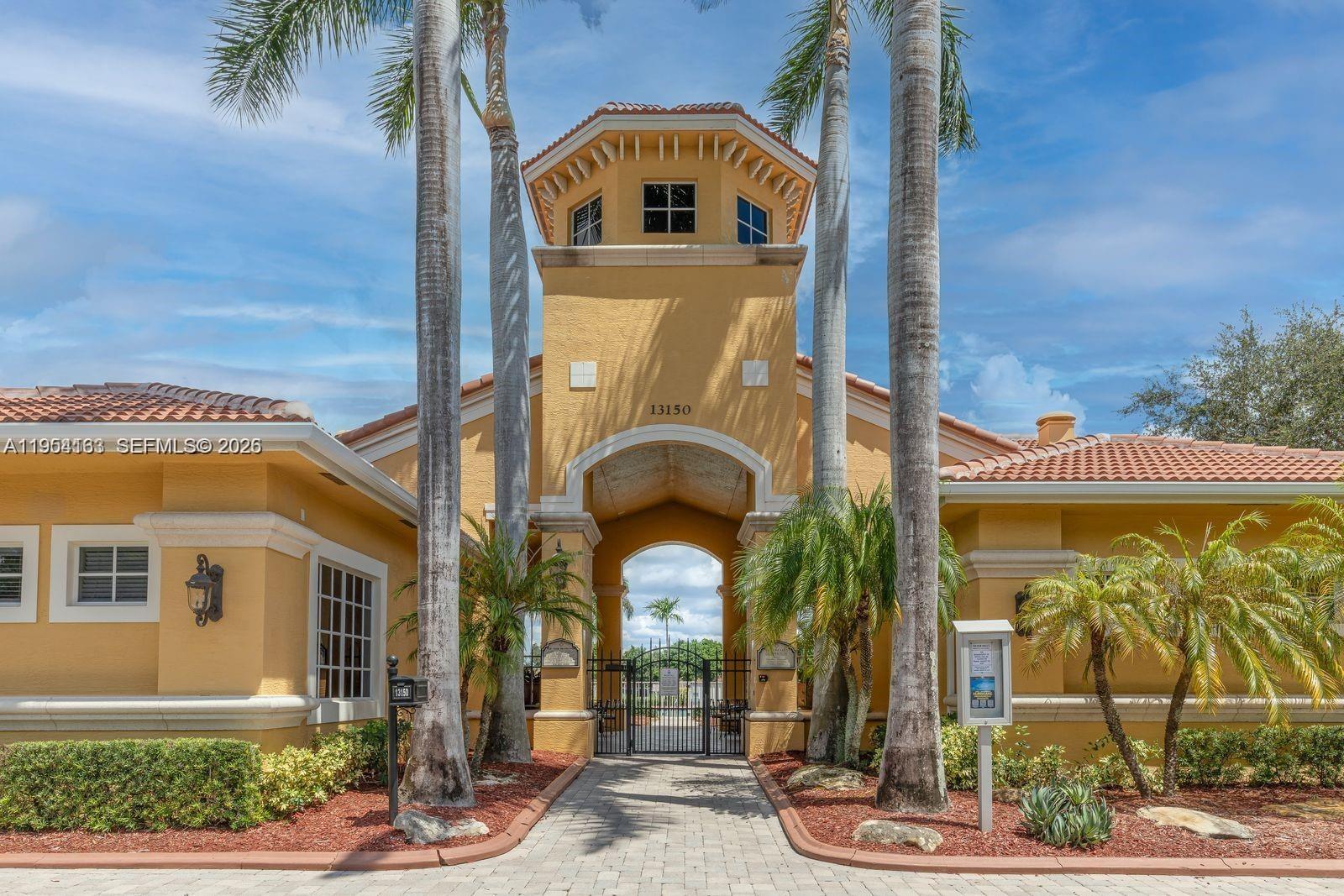 13216 Southwest 44th Street, Unit 11204 Miramar, FL 33027 - Photo 3 of 47 a front view of a house with garden