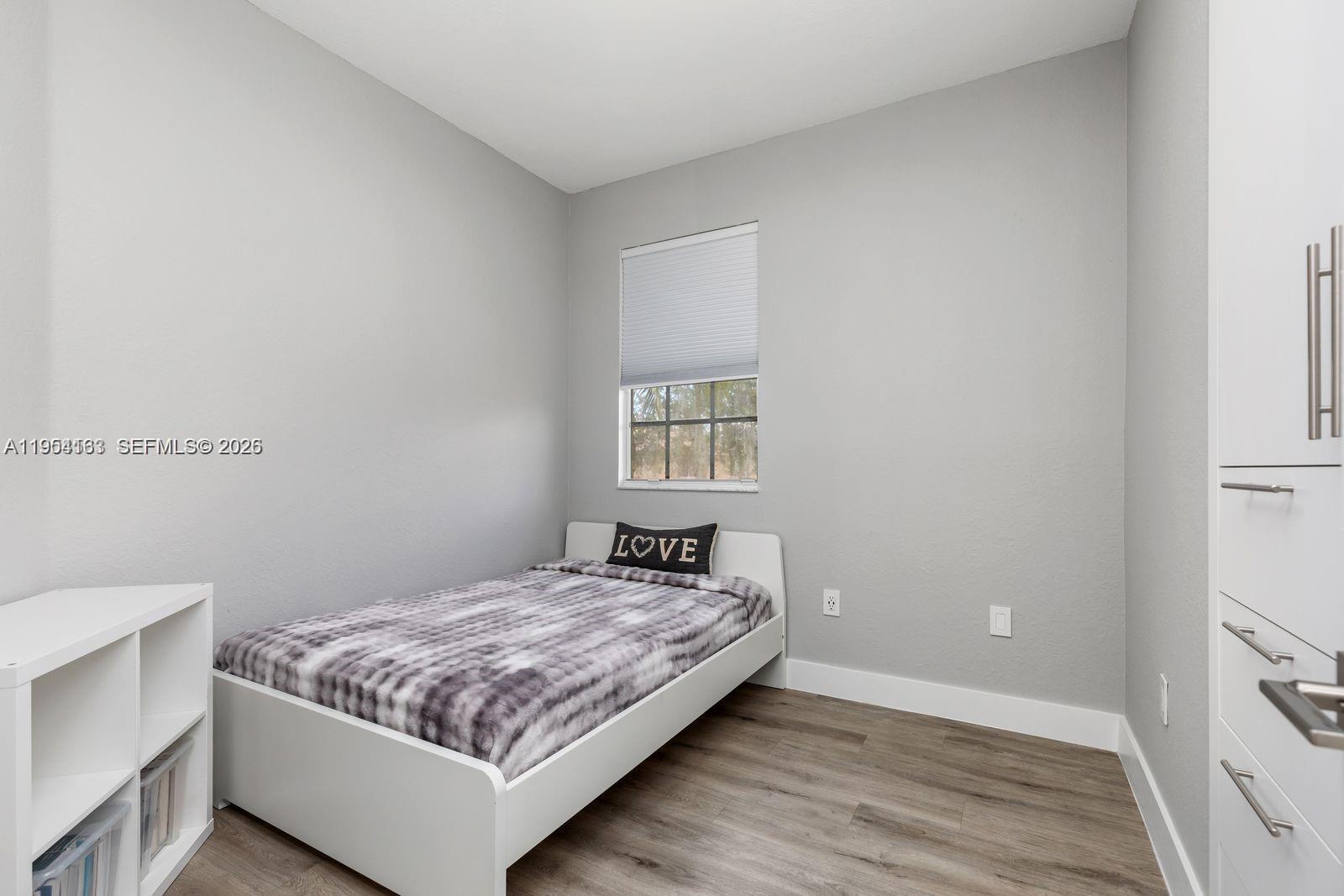 13216 Southwest 44th Street, Unit 11204 Miramar, FL 33027 - Photo 33 of 47 a bedroom with a bed and window