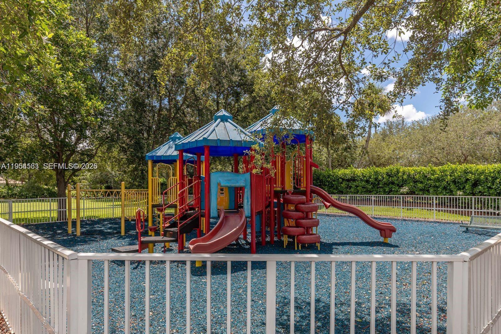 13216 Southwest 44th Street, Unit 11204 Miramar, FL 33027 - Photo 7 of 47 a view of a park with iron fence