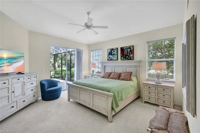 a bedroom with a bed a dresser and a window