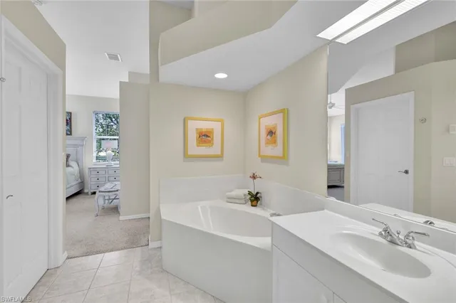 a bathroom with a bathtub sink and a toilet