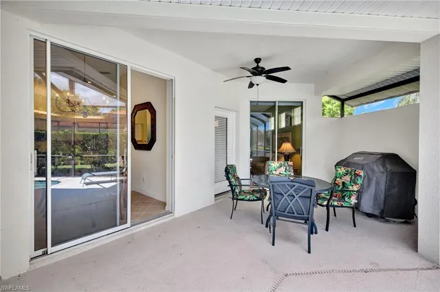 a living room with furniture a window and a fireplace