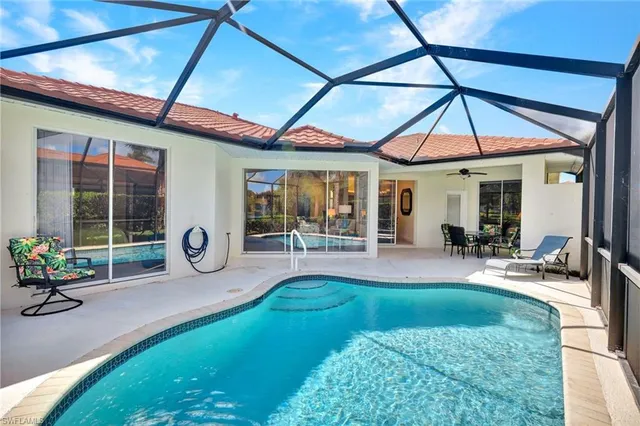 a view of a house with backyard porch and furniture