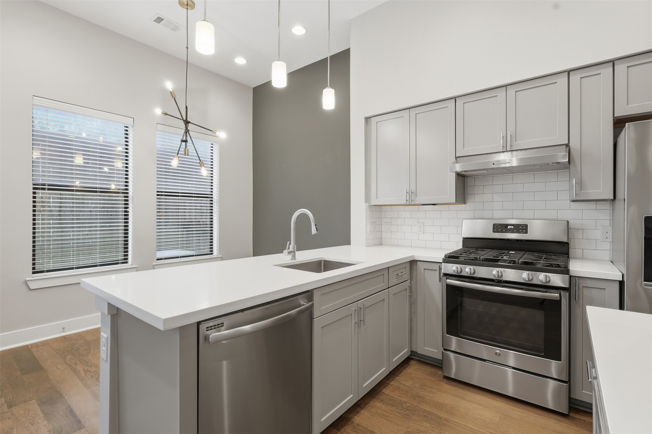 614 Thornton Road, Unit D Houston, TX 77018 - Photo 9 of 32 Abundant cabinetry and stainless-steel appliances create a polished, functional kitchen designed for everyday living and entertaining.