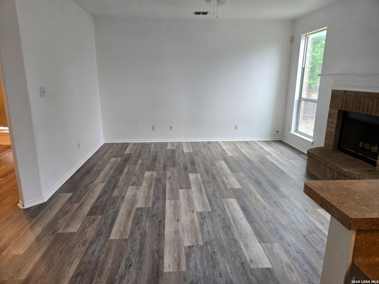 405 Point Valley San Antonio, TX 78253 - Photo 11 of 16 a view of wooden floor and a fireplace in a room