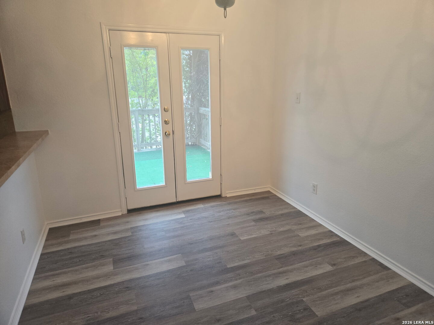 405 Point Valley San Antonio, TX 78253 - Photo 6 of 16 a view of an empty room with wooden floor and a window