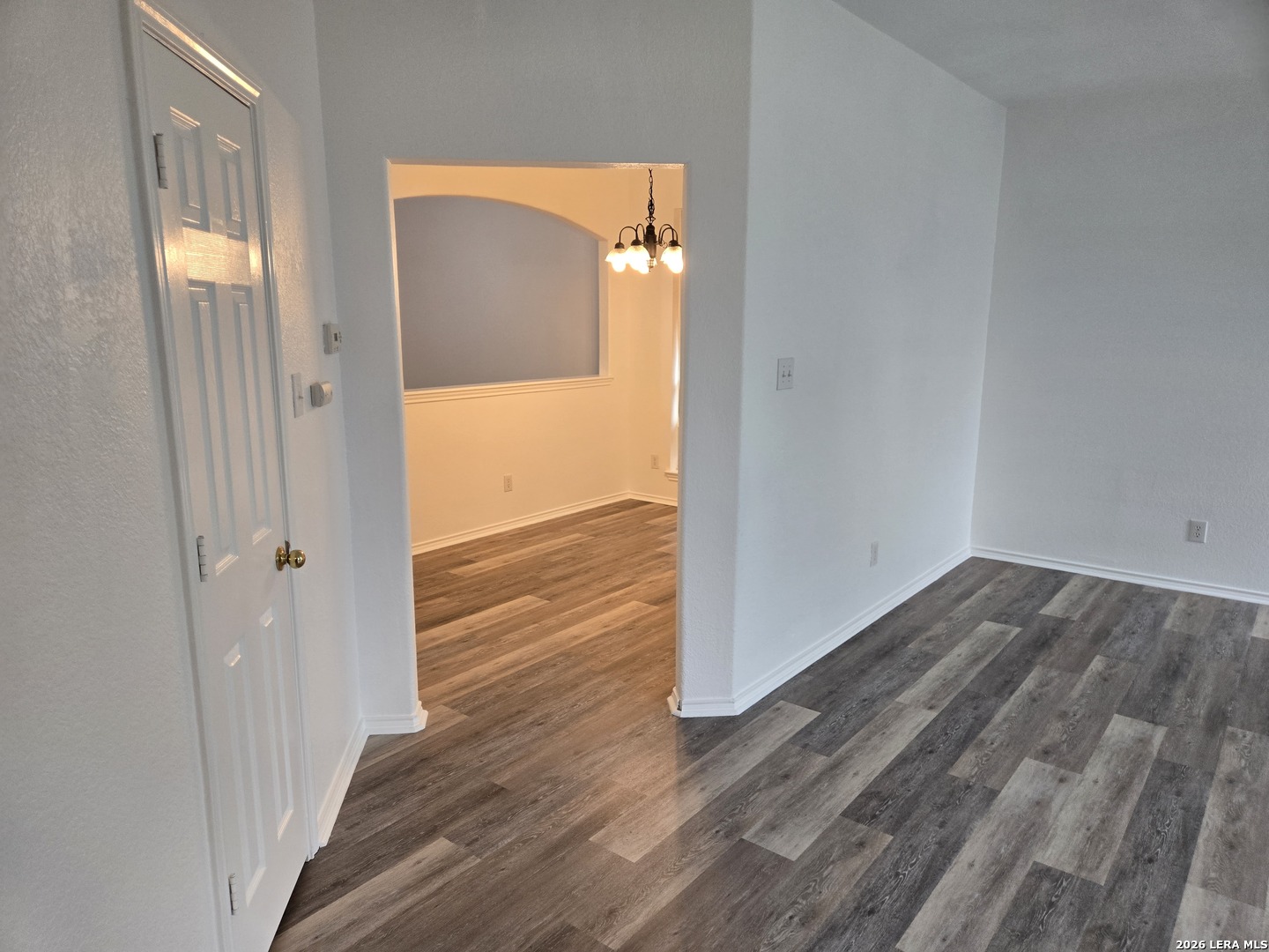 405 Point Valley San Antonio, TX 78253 - Photo 8 of 16 an empty room with wooden floor and windows