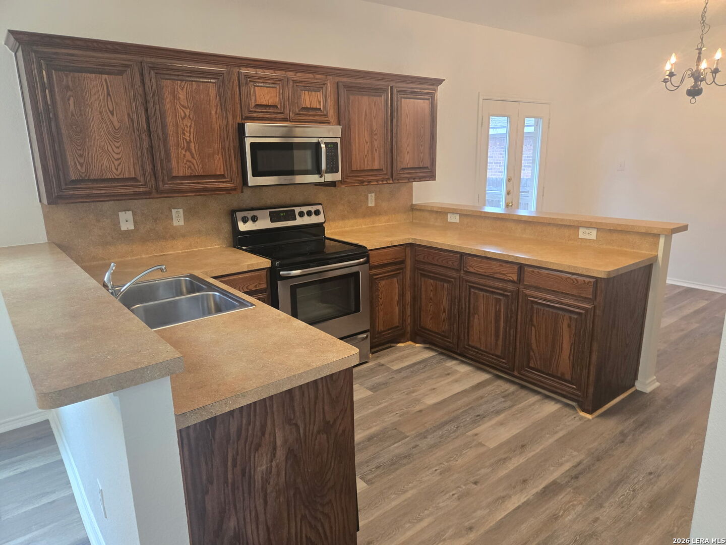 405 Point Valley San Antonio, TX 78253 - Photo 9 of 16 a kitchen with a sink stove and microwave