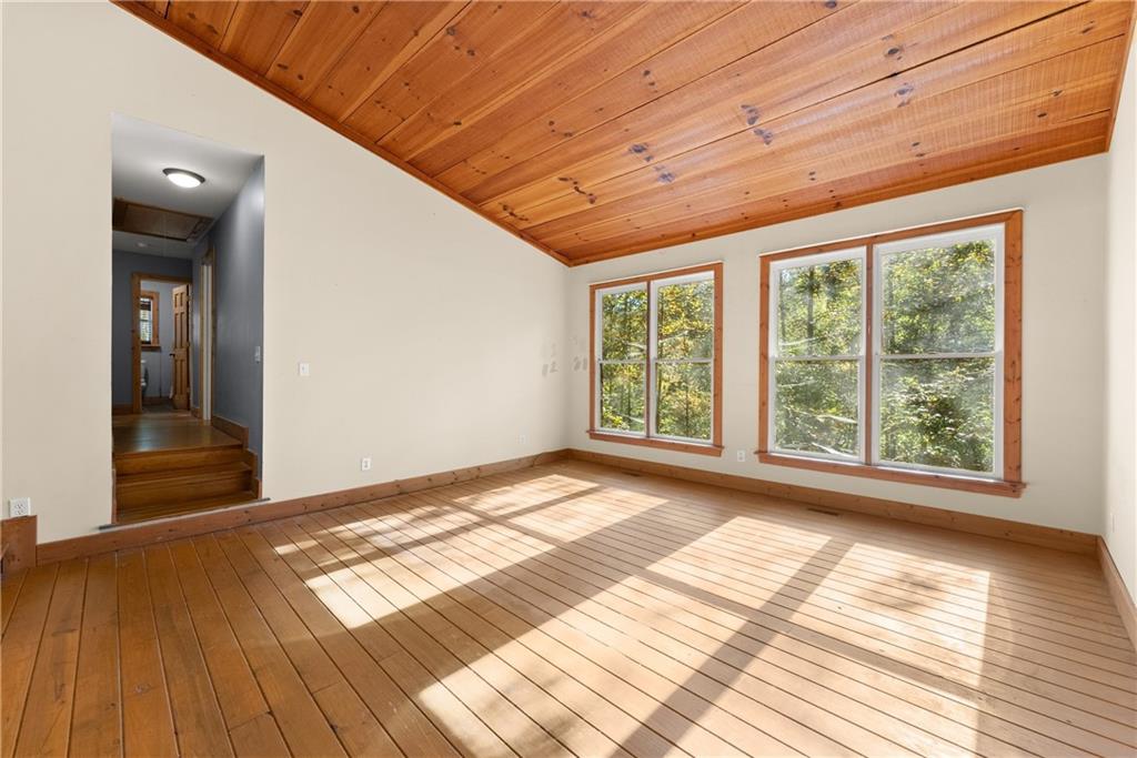 773 Shorewood Circle Toccoa, GA 30577 - Photo 11 of 39 a view of empty room with wooden floor and fan