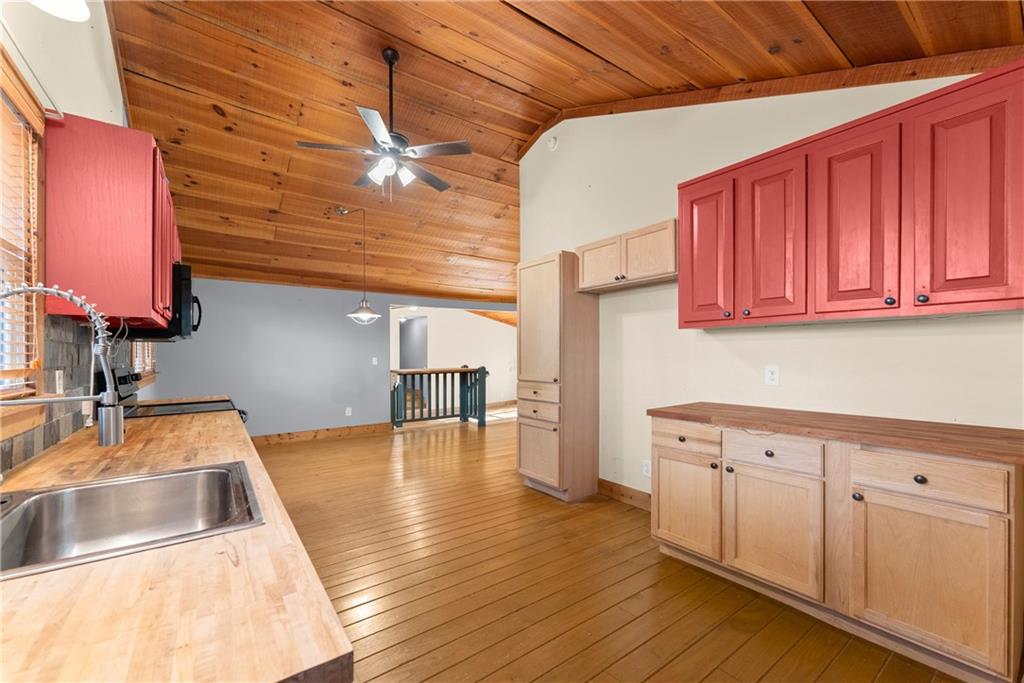 773 Shorewood Circle Toccoa, GA 30577 - Photo 13 of 39 a kitchen with a sink cabinets and wooden floor