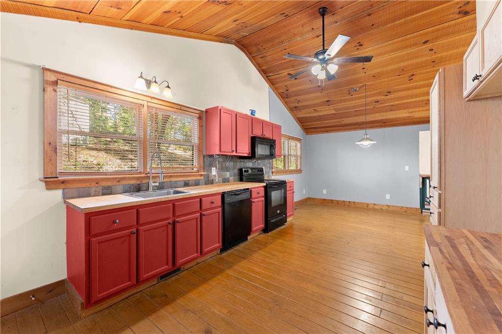 773 Shorewood Circle Toccoa, GA 30577 - Photo 14 of 39 a open kitchen with stainless steel appliances granite countertop a sink and dishwasher a stove with wooden floor