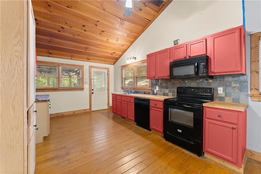 773 Shorewood Circle Toccoa, GA 30577 - Photo 15 of 39 a kitchen with stainless steel appliances granite countertop a stove a sink and a refrigerator