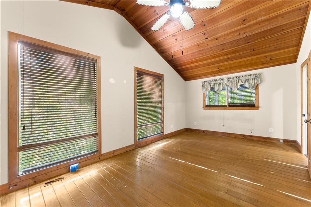 773 Shorewood Circle Toccoa, GA 30577 - Photo 18 of 39 a view of an empty room with a window and wooden floor