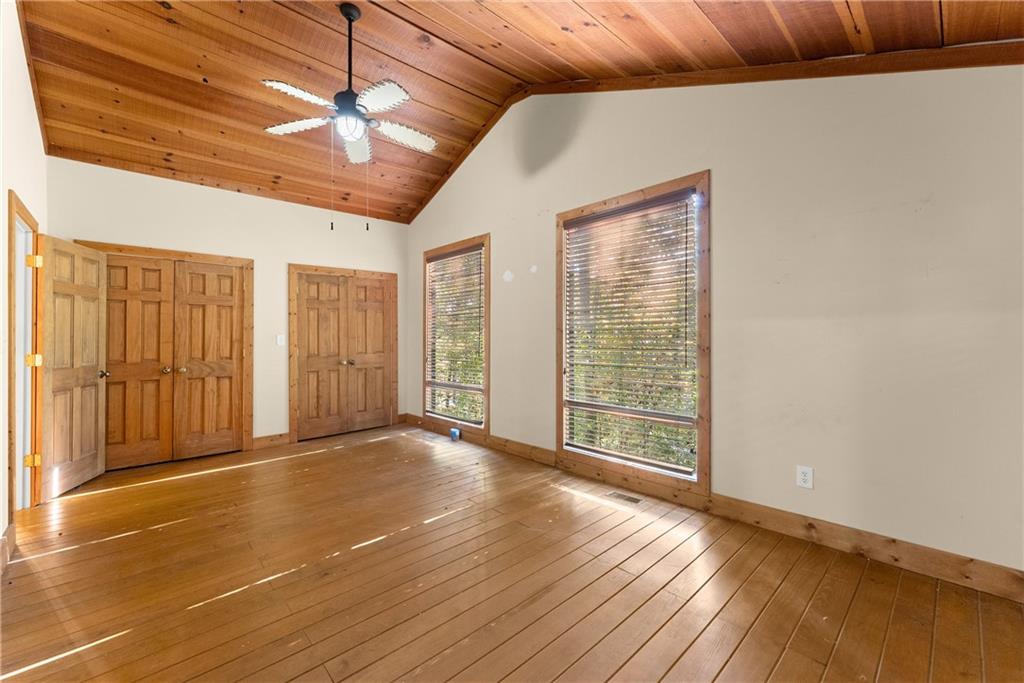 773 Shorewood Circle Toccoa, GA 30577 - Photo 19 of 39 a view of an empty room with wooden floor and a window