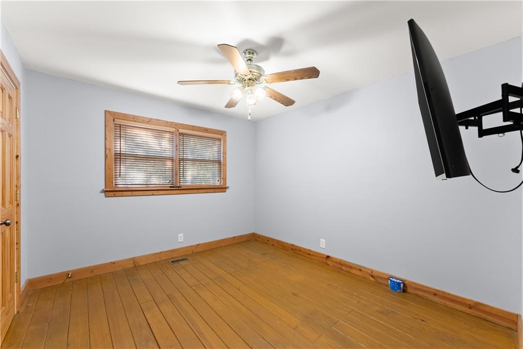 773 Shorewood Circle Toccoa, GA 30577 - Photo 26 of 39 a view of empty room with wooden floor and fan