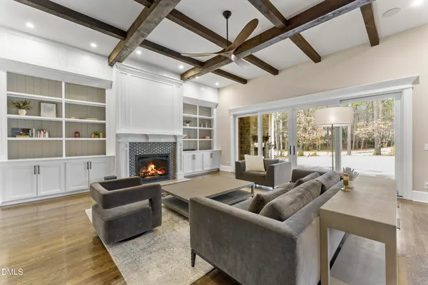 a view of a dining room with furniture wooden floor and chandelier