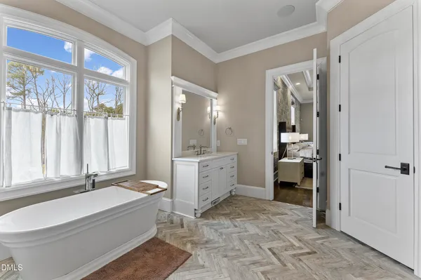 a bedroom with a bed and a lamp