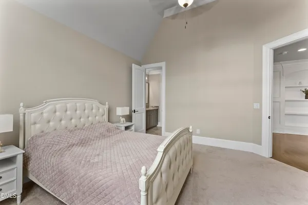 a bed room with a bed and a window