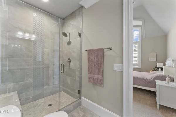a bathroom with a tub and a shower