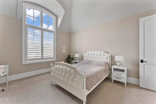 a living room with furniture a ceiling fan and a window