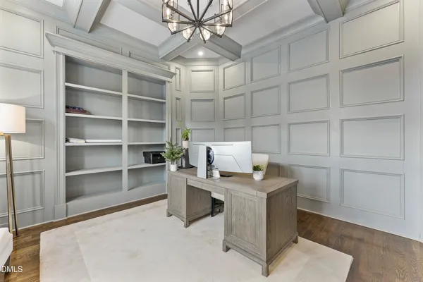 a view of a livingroom with furniture and a table