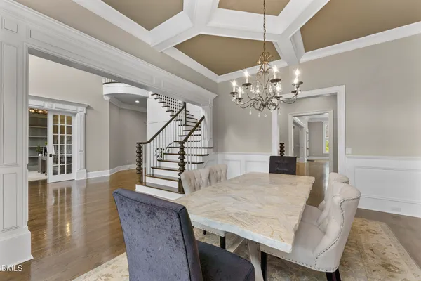 a view of entryway with wooden floor and front door