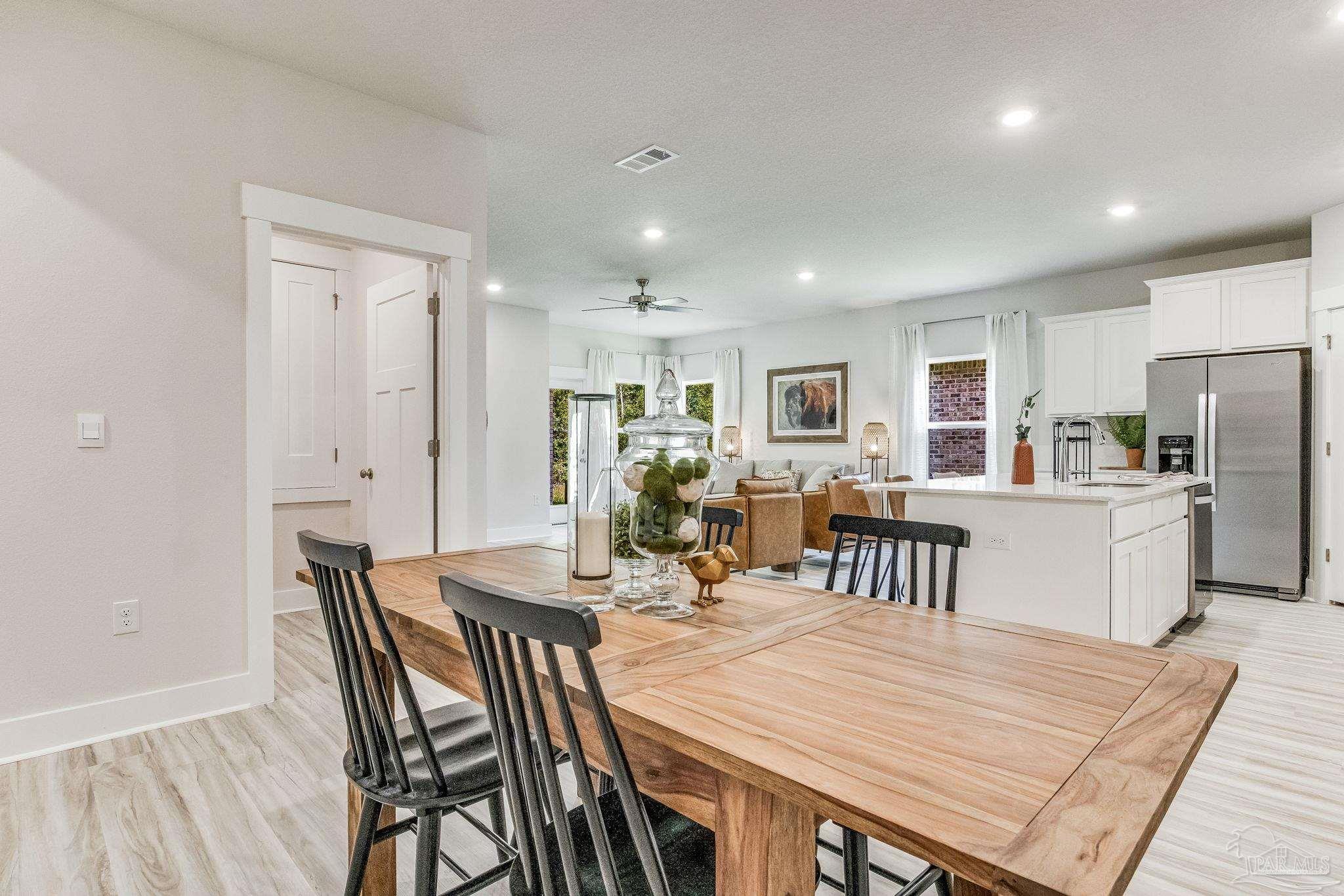 9793 Windy Hill Road Pensacola, FL 32526 - Photo 15 of 36 a view of a dining room with furniture